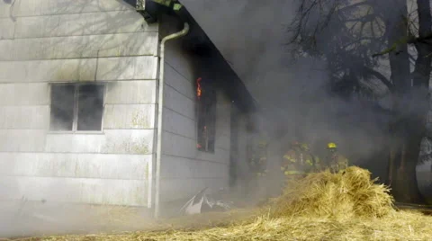 Firefighters start to put out fire Stock Footage 60959436