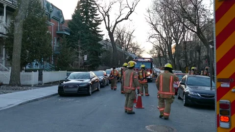 Firefighters in the street during spring Stock Footage 138530837