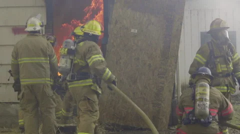Firefighters struggle with hose Stock Footage 60752807