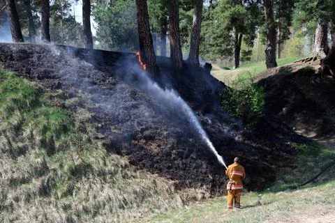 Firefighters successfully contain large grass fire threatening rural homes Stock Photos