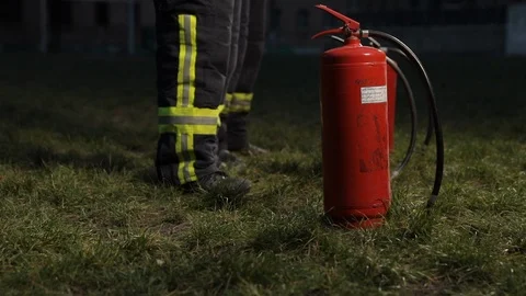 Firefighters Take Fire Extinguishers And Go Away Stock Footage 101671149
