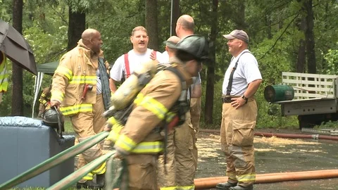FIREFIGHTERS TAKING A BREAK Stock Footage 93594414