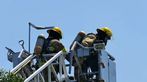 Firefighters on top of ladder Stock Footage 114808717