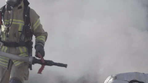 Firefighters training to extinguish a burning car 스톡 동영상 266883049