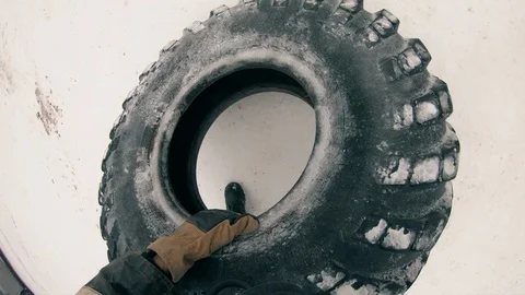 Firefighters training.A firefighter rolls a wheel from a truck. Stock Footage 121363718