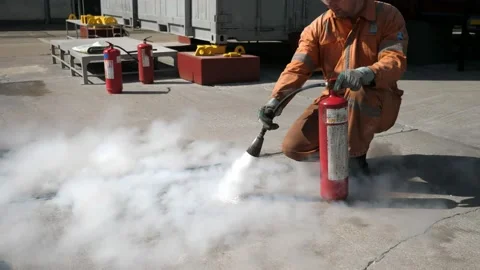 Firefighters training session on the use of a fire extinguisher. Stock-Footage 135800823