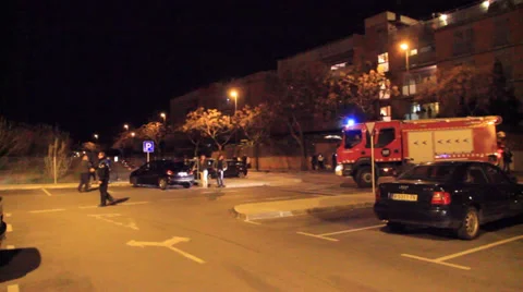 Firefighters try to douse a fire started very near of housings Stock Footage 34450463