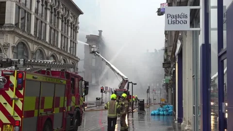 Firefighters try to put out fire near Glasgow Central Station Stock Footage 330404251