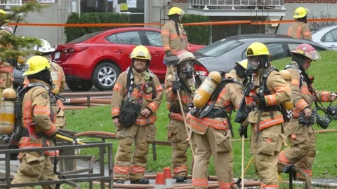Firefighters under the rain Stock Footage 139664322