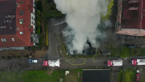 Firefighters Use Hoses To Stop Flames In Residential House Fire In Urban Street Stock Footage 315351290