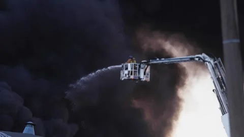 Firefighters use telescopic tower during blaze fire, firetruck with crane Vídeos de archivo 283133650