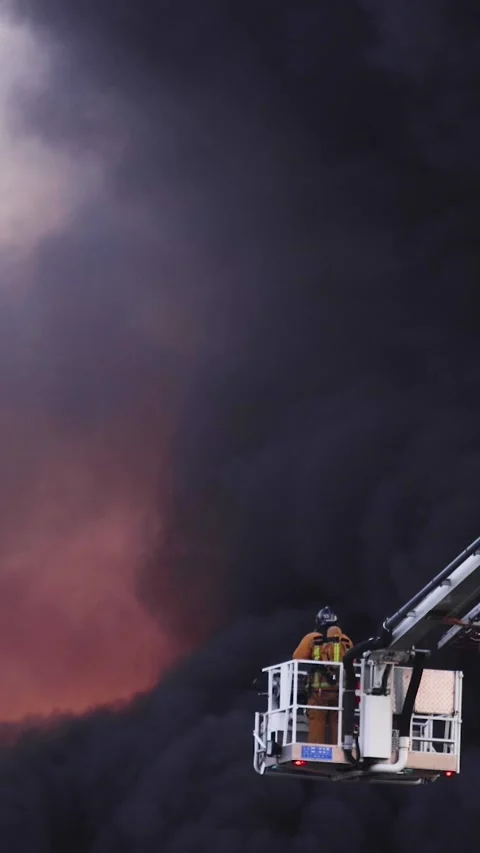 Firefighters use telescopic tower during blaze fire, firetruck with crane Vídeos de archivo 283134014