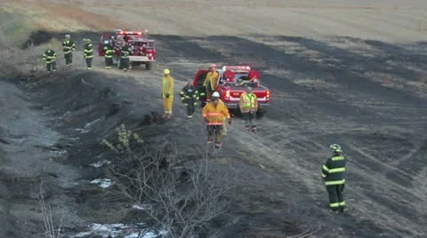 Firefighters using Backhoe Video stock 12439365