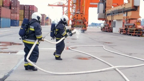 Firefighters using fire-extinguishing foam Stock Footage 92421214