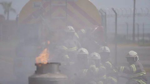 Firefighters using a fire hose during an emergency training drill in Monterrey Stock Footage 345101513