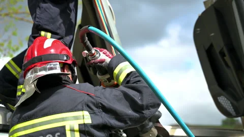 Firefighters using hydraulic tools during a rescue operation training. Rescuers Stock Footage 242405756