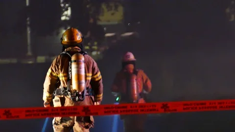Firefighters walking at fire scene Stock Footage 116119748