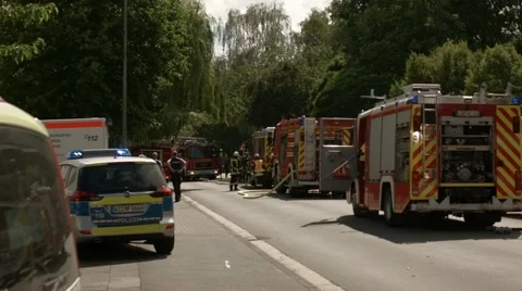 Firefighters at work in a residential area Stock Footage 64751918