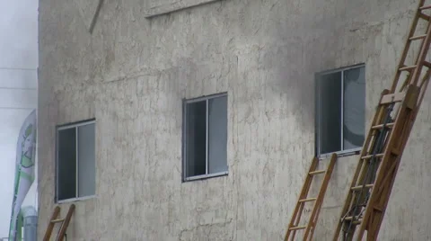 Firefighters at Work - Smokey windows Stock Footage 1650731