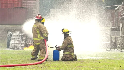 Firefighters work together during a live training drill Vídeos de archivo 326216994