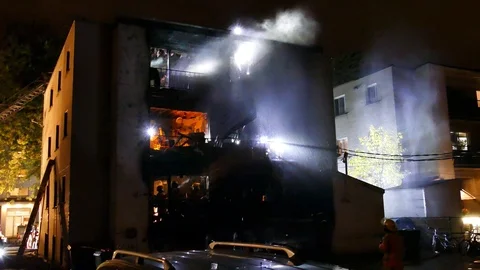 Firefighters working on active apartment fire Stock Footage 120162074
