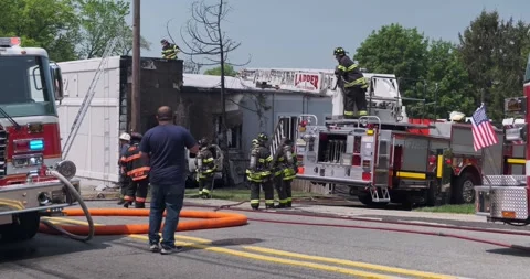 Firefighters working on the auto accident scene, Leonia - 4K Stock-Footage 240964547
