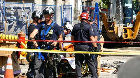 Firefighters working on construction site Stock Footage 115972534