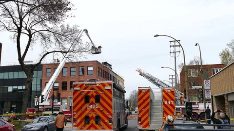 Firefighters working at fire scene Stock Footage 114707330