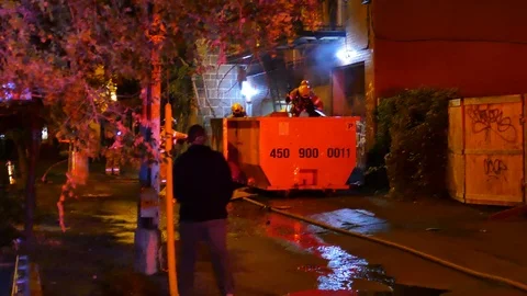 Firefighters working at garbage fire Stock Footage 116711896