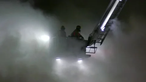 Firefighters working in heavy smoke Stock Footage 139657059