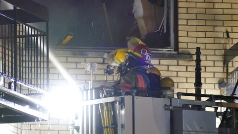 Firefighters working at night Stock Footage 114754395