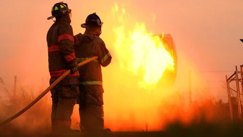FireFighterTeam train spraying water Stock Footage 126587637