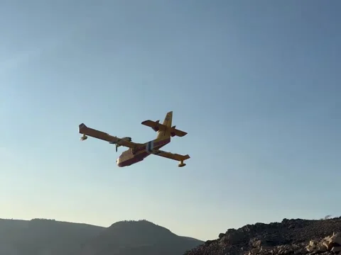 Firefighting Amphibious Airplane Scooping Water From Lake Video stock 342264658