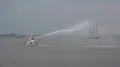 Firefighting boat demonstration at rainy cloudy day Bremerhaven harbor 4k or 4k+ Resolution