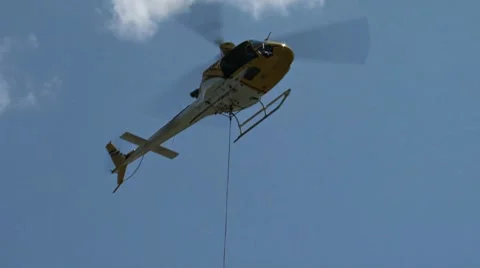Firefighting Helicopter with Drop Bucket Stock Footage 8561380