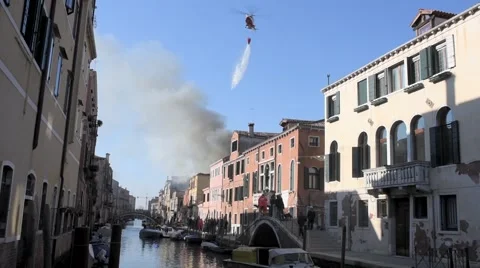 Firefighting helicopter drops water over fire in Venice, Italy Stock-Footage 47175665