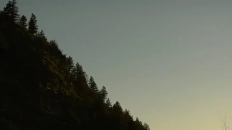 Firefighting helicopter flies into sunset Stock Footage 21535510