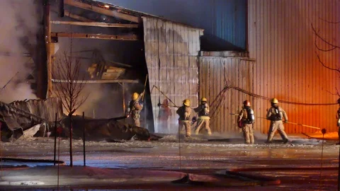 Fireghters working on metal sheet Stock Footage 103626498