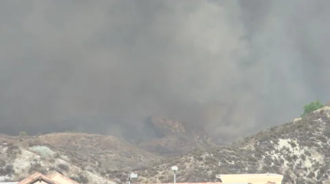 Firehawk helicopter makes high approach and water drop (Sand Fire) Stock Footage 65762957