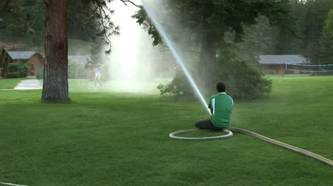 Firehose Fun with Kids Stock Footage 33738935