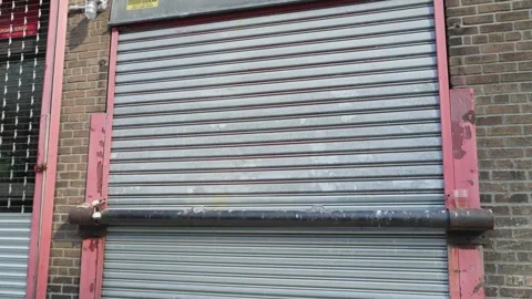 Firehouse fire fighter fire station garage door in New York Stock Footage 242306426