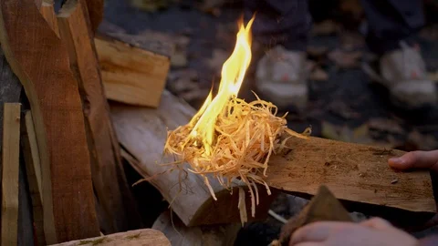 Firemaking with Burning Hay on Wood Stock-Footage 122333411