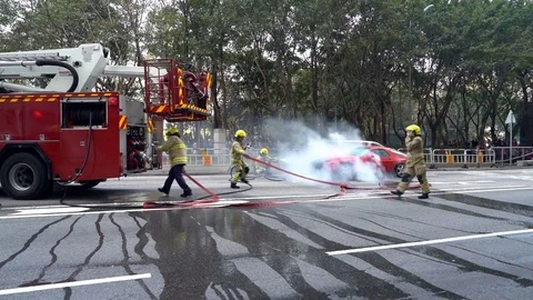 Fireman in Action, Car on Fire 4K Stock Footage 78572401