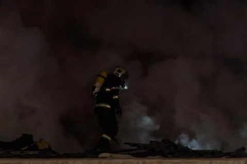 Fireman in action Stock Photos