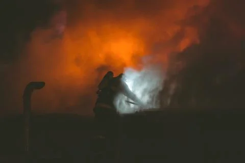 Fireman in action Stock Photos