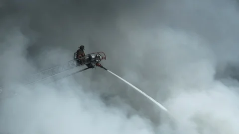 Fireman Appears From The Smoke Video stock 87572322