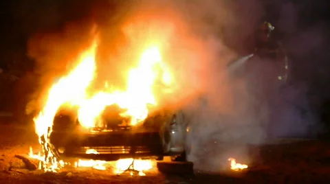 Fireman &amp; burning car 1 Stockbeeldmateriaal 497228
