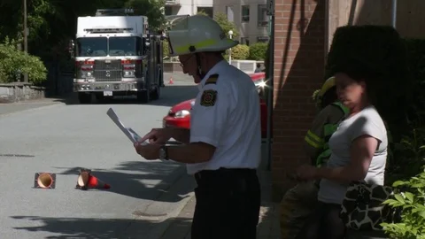 Fireman chief officer talking to a fireman. 스톡 동영상 76758024