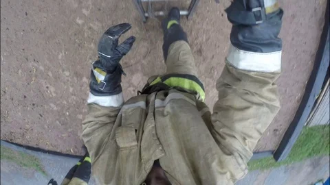 The fireman climbs the retractable ladder. Fire protection. Stock Footage 79489876