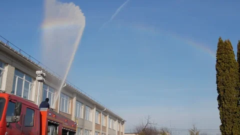 The fireman created a rainbow. Video stock 121689616